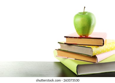 Books and apple on desk, isolated on white - Powered by Shutterstock