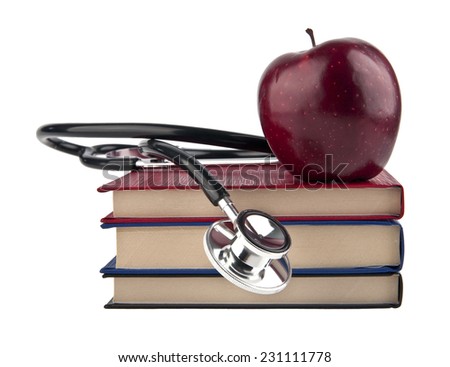 books, Apple and stethoskop on white background