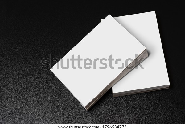 Books with blank cover on dark glossy table, editable\
mock-up series ready for your design, cover selection path\
included. 