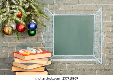 Books   Christmas decorations before blackboard and blank space for your text