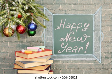 Books   Christmas decorations before chalkboard and title: Happy New Year!