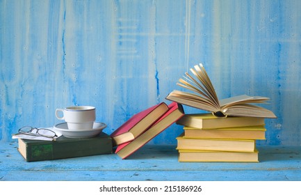 Books with a cup of coffee, spectacles, free copy space - Powered by Shutterstock