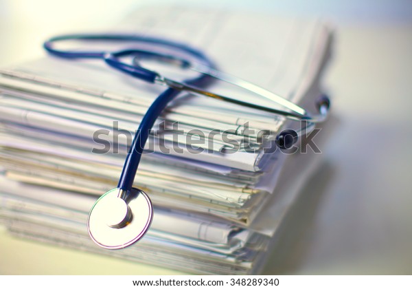 books folder file and stethoscope isolated on\
white background