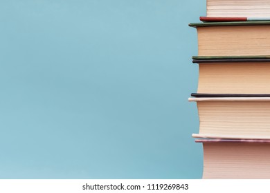 Books are on a blue background. Back to school. Business or education concept. Free space for text or advertisement.  - Shutterstock ID 1119269843