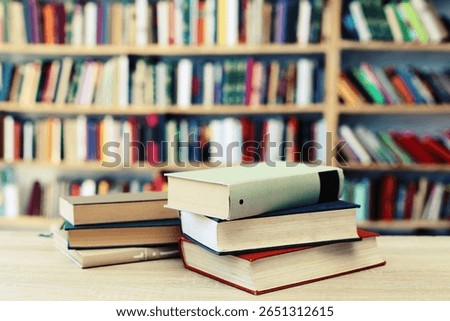 books on the table, 
stack of books,stack of books on white blurred background, education, reading, 
High quality photos of books, school, library, William Shakespeare