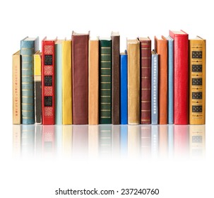 Books on white background with reflection