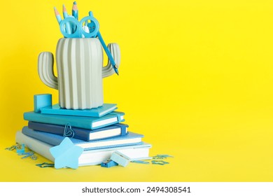Books and pencil holder with school supplies on yellow background - Powered by Shutterstock