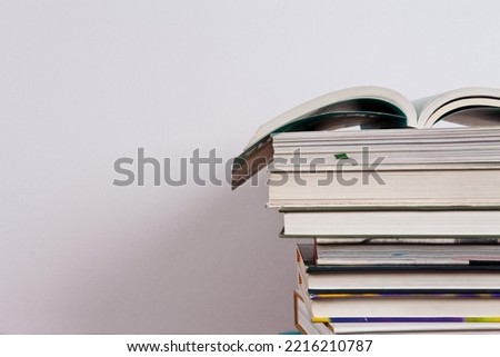 Books and school supplies on a white background with clipping path. You can change the background to whatever you want