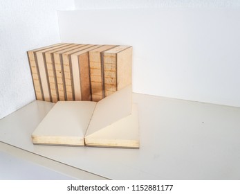 Books stacking with white table and background.