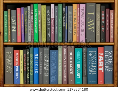 Bookshelves with books covering a variety of topics. (All spines have been fabricated to avoid copyright issues.)