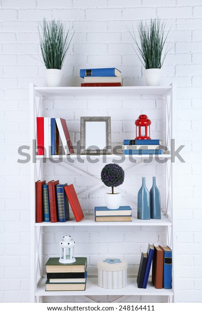 Bookshelves Books Decorative Objects On Brick Stock Photo Edit