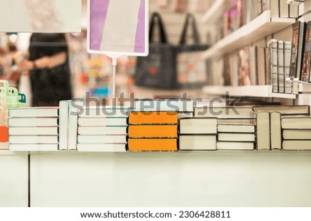 Bookstore display window, Bookshelves with books. Education, school, study, reading fiction. Abstract blurred background