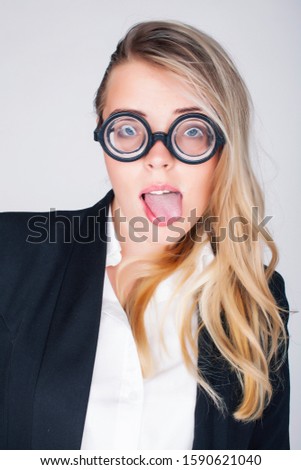 bookworm, cute young blond woman in glasses, blond hair, teenage goofy, lifestyle people concept