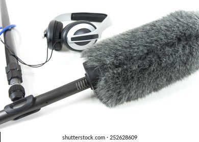 Boom Mic And Headphones Over White