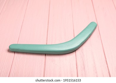 Boomerang On Pink Wooden Background. Outdoors Activity