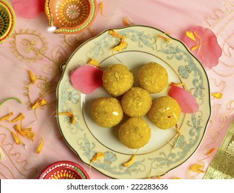 Boondi Laadu - an indian sweet displayed on a plate. festive set up.