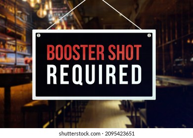 A Booster shot required sign at a bar, tavern or pub. Proof or vaccination required to enter a shop or business establishment.
