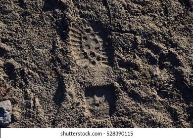 boot in sand/mud background
