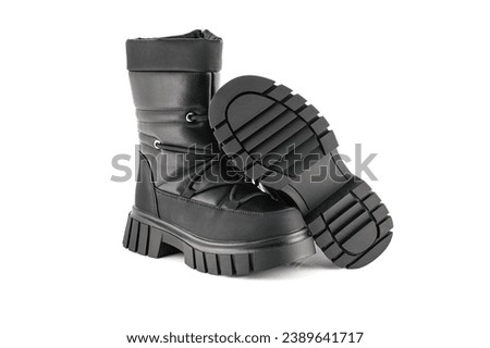 Boots for a modern grunge woman. Women's black boots with laces isolated on white. Black  Leather Army Boots.