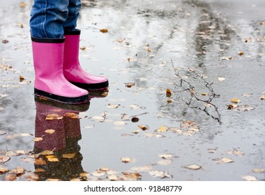 Boots in a puddle - Powered by Shutterstock