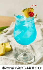 Boozy Blue Hawaii Hurricane Cocktail with Rum and Pineapple