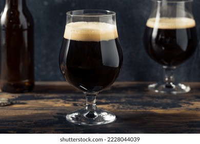 Boozy Cold Craft Porter Stout Beer in a Footed Glass - Powered by Shutterstock