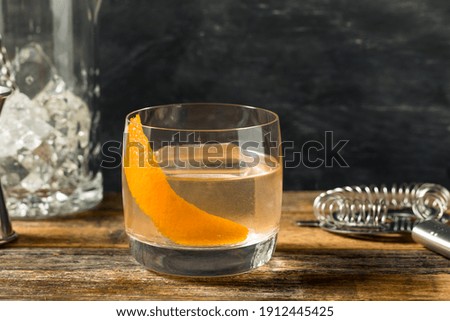 Boozy Moonshine Old Fashioned Cocktail with an Orange Peel 商業照片 © 