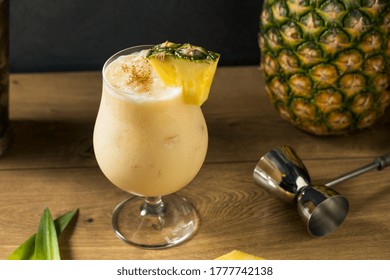 Boozy PIneapple Painkiller Cocktail with Coconut Cream and Nutmeg - Shutterstock ID 1777742138
