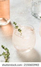 Boozy Pink Rose Wine Spritzer With Ice And Thyme