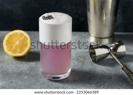 Boozy Purple Lavender Gin Fizz Cocktail with Lemon and Soda Water
