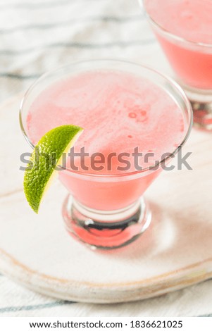 Boozy Refreshing Cranberry Cosmopolitan Cocktail with LIme Garnish