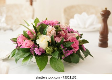 Boquet Of Orchid Flowers And Tulips On Arranged Table