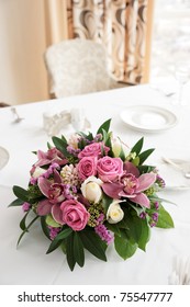 Boquet Of Orchid Flowers And Tulips On Arranged Table