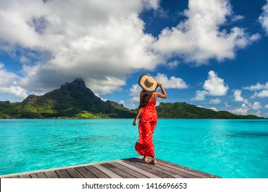 Bora Bora Island Luxury Resort Hotel Woman Relaxing At View Of Mt Otemanu In Tahiti, French Polynesia Honeymoon Travel Destination For Summer Vacation.