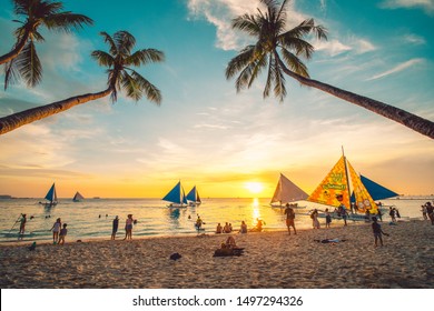 Boracay, Philippines - 12 April 2019: People enjoying a spectacular sunset at Boracay island in Philippines.