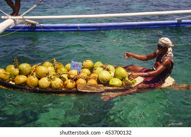 Boracay, Philippines - July 16, 2016: Man Selling Coconuts To Tourists To Crocodile Island