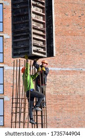 Boratyn, Ukraine- March 26, 2020: Workers At Construction Site Are Installing Demountable And Permanent Formwork