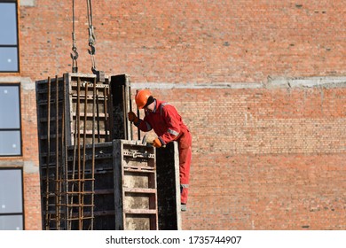 Boratyn, Ukraine- March 26, 2020: Workers At Construction Site Are Installing Demountable And Permanent Formwork