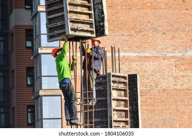 Boratyn, Ukraine- March 26, 2020: Workers At Construction Site Are Installing Demountable And Permanent Formwork