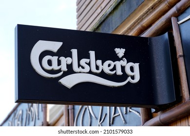 Bordeaux , Aquitaine  France - 01 04 2022 : Carlsberg text brand and sign logo of beer front of bar restaurant in french street for pub