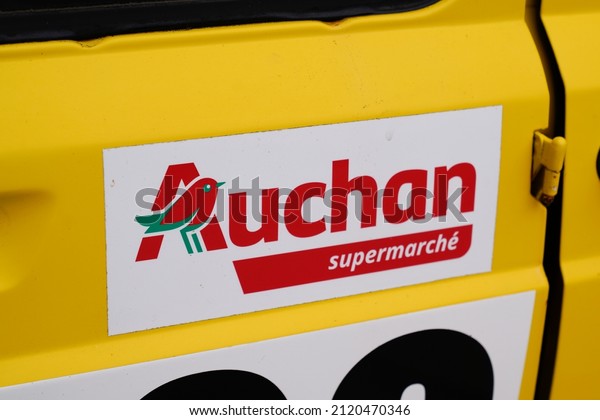 Bordeaux , Aquitaine  France - 02 02 2022 :\
Auchan supermarche brand text supermarket logo sign on sticker side\
racing car of French grocery retailer\
shop