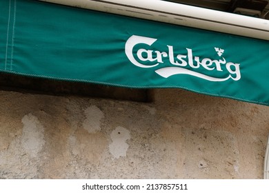 Bordeaux , Aquitaine  France - 03 20 2022 : carlsberg beer sign text and brand logo on flag facade bar pub restaurant