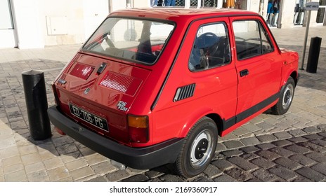 Bordeaux , Aquitaine  France - 06 12 2022 : fiat 126 red vintage model old timer car in street parked
