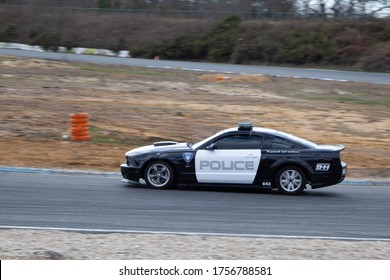 Bordeaux , Aquitaine / France - 06 14 2020 : Ford Mustang Police Car Black And White Replica Of Decepticon In Race Track Like Disney Transformers Film