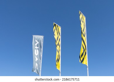 Bordeaux , Aquitaine  France - 08 01 2022 : Dacia Renault Car Dealership Store Sign And Text Brand On Flags In Wind With New Logo Automotive Manufacturer Vehicles