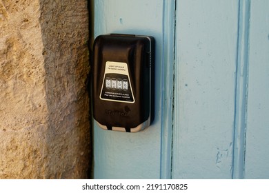 Bordeaux , Aquitaine  France - 08 15 2022 : Master Lock Light Up Dials Logo Brand And Text Sign On Keys Box In Home Door Rental Facade