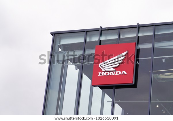 Bordeaux , Aquitaine / France - 10 01 2020 : honda\
logo and sign motorcycle of dealership store motorbike company on\
building shop wall