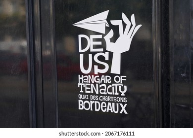 Bordeaux , Aquitaine France - 10 25 2021 : Deus Ex Machina hangar of tenacity in bordeaux french city logo text and sign front of fashion clothing motorcycle skateboard concept shop