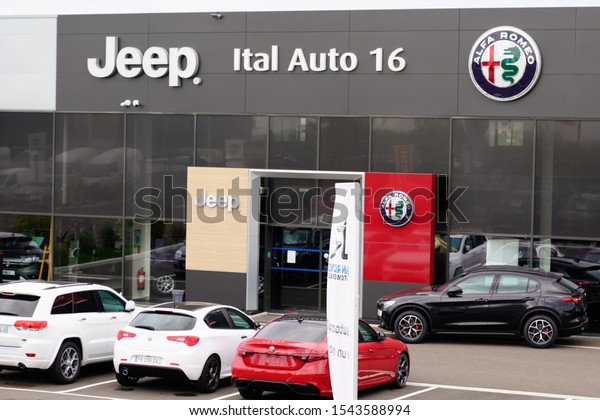 Bordeaux , Aquitaine / France - 10 27 2019 :\
Alfa Romeo and Jeep car logo sign shop showroom store Italian\
american brand of\
automotive