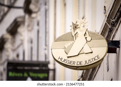 BORDEAUX, FRANCE - FEBRUARY 21, 2022: Huissier de Justice logo on a plate indicating its office in Bordeaux. It is the french equivalent of bailiff, a judicial officer, or officer of the court
